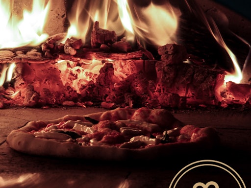 Here's a peek at a pizza baking in the wood flames